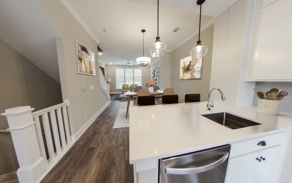 Open concept townhome with kitchen, living, and dining area