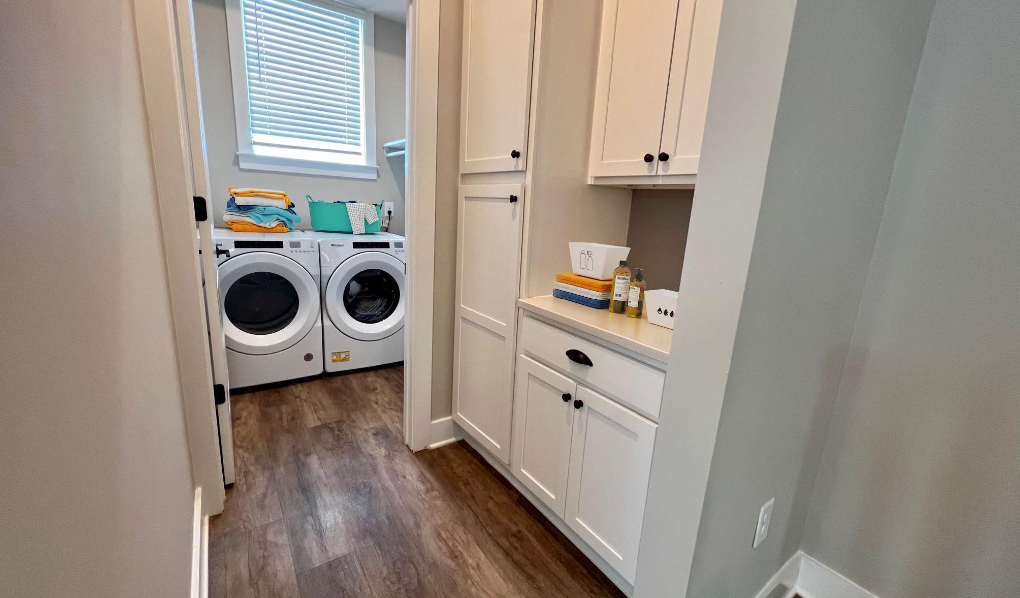 Townhomes at Bridlestone laundry rooom with modern washer and dryer
