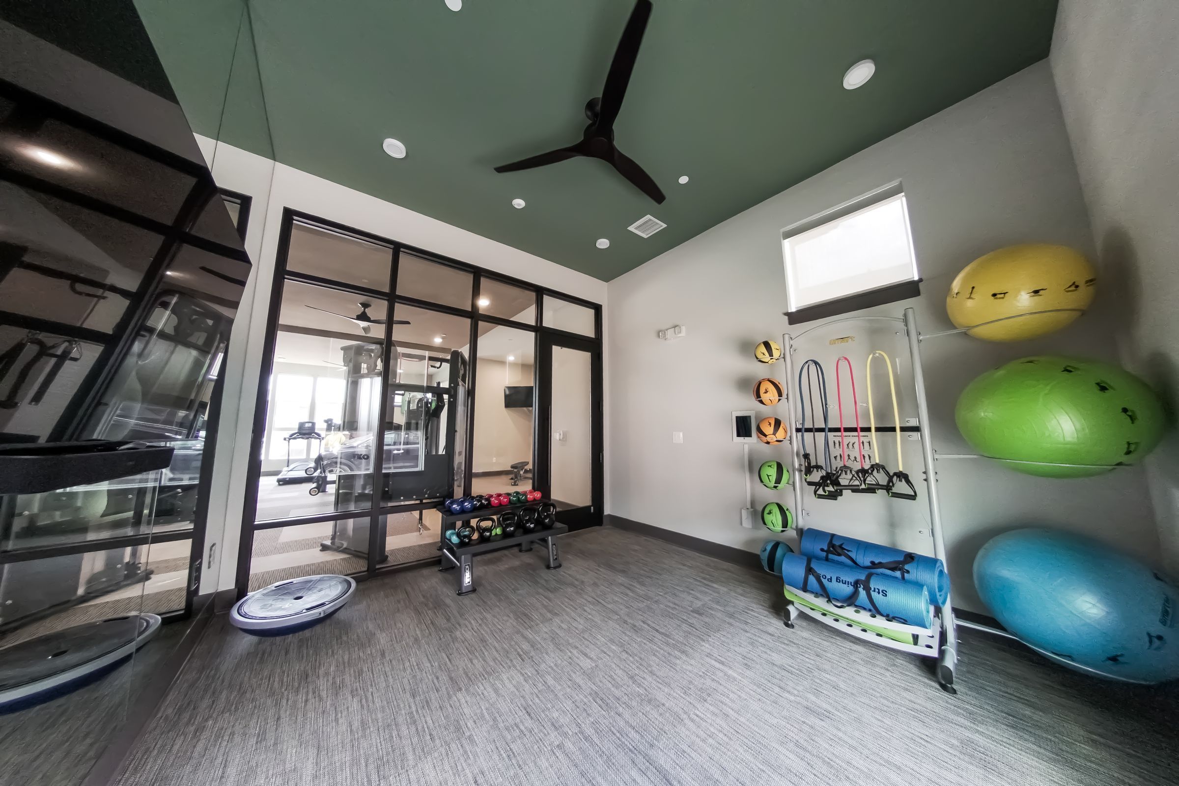 Townhomes at Bridlestone fitness center with strength training equipment