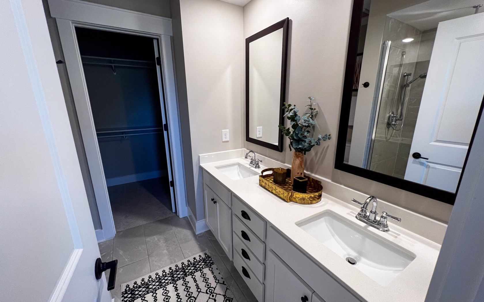 Townhomes at Bridlestone luxury modern bathroom with dual vanity and recessed lighting