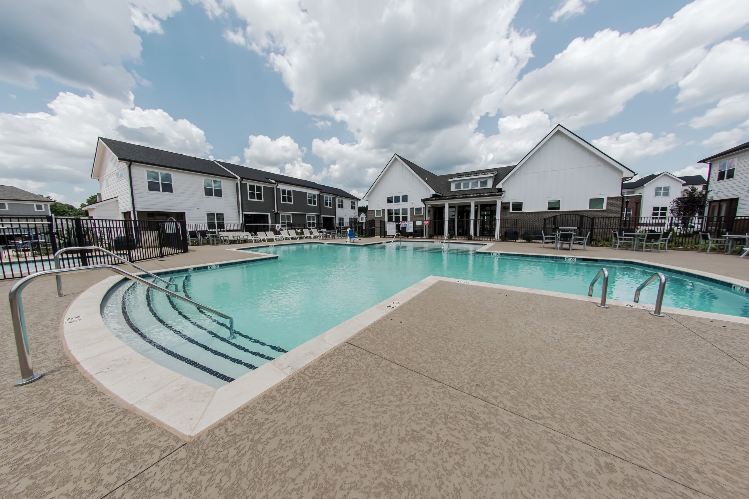 The Townhomes at Bridlestone outdoor pool with surrounding townhomes