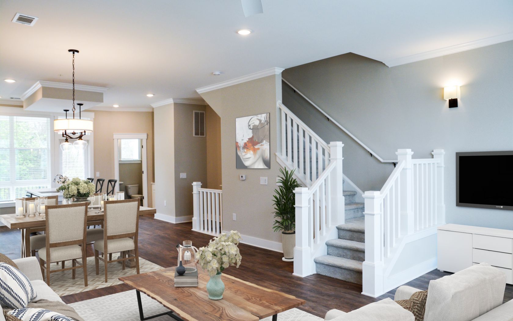 Townhomes at Bridlestone living room furnished with couch and coffee table and featuring grand staircase