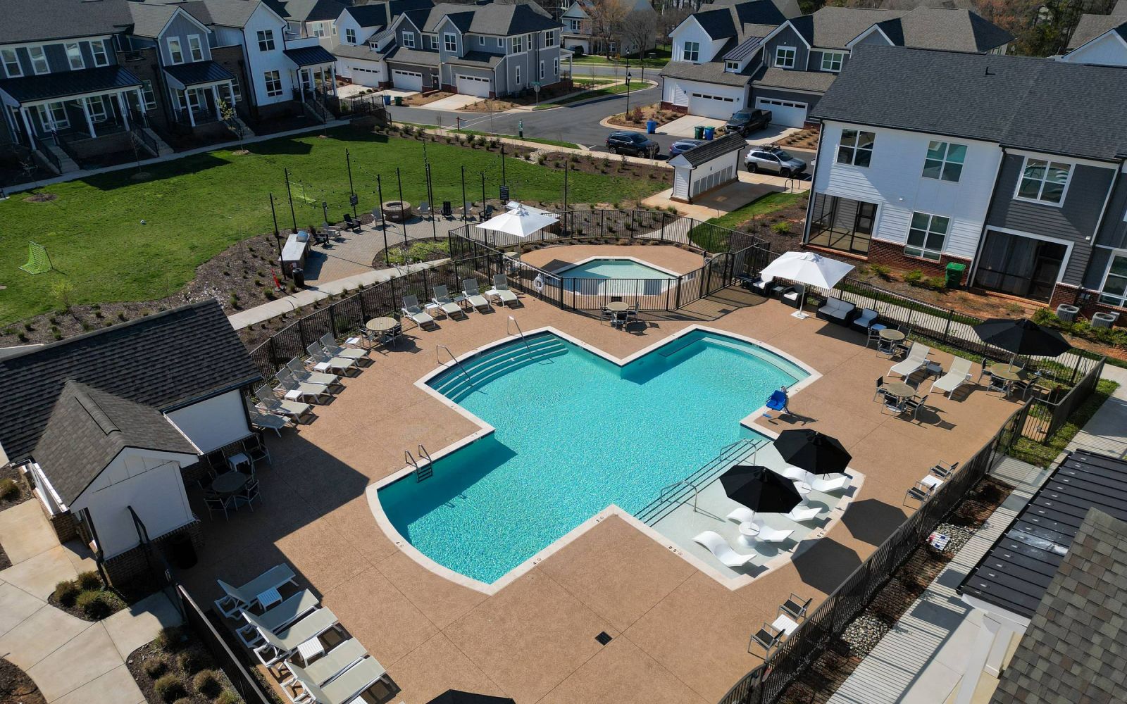 Aerial view of the The Townhomes at Bridlestone community in Pineville, NC showing the outdoor pool and surrounding townhome buildings