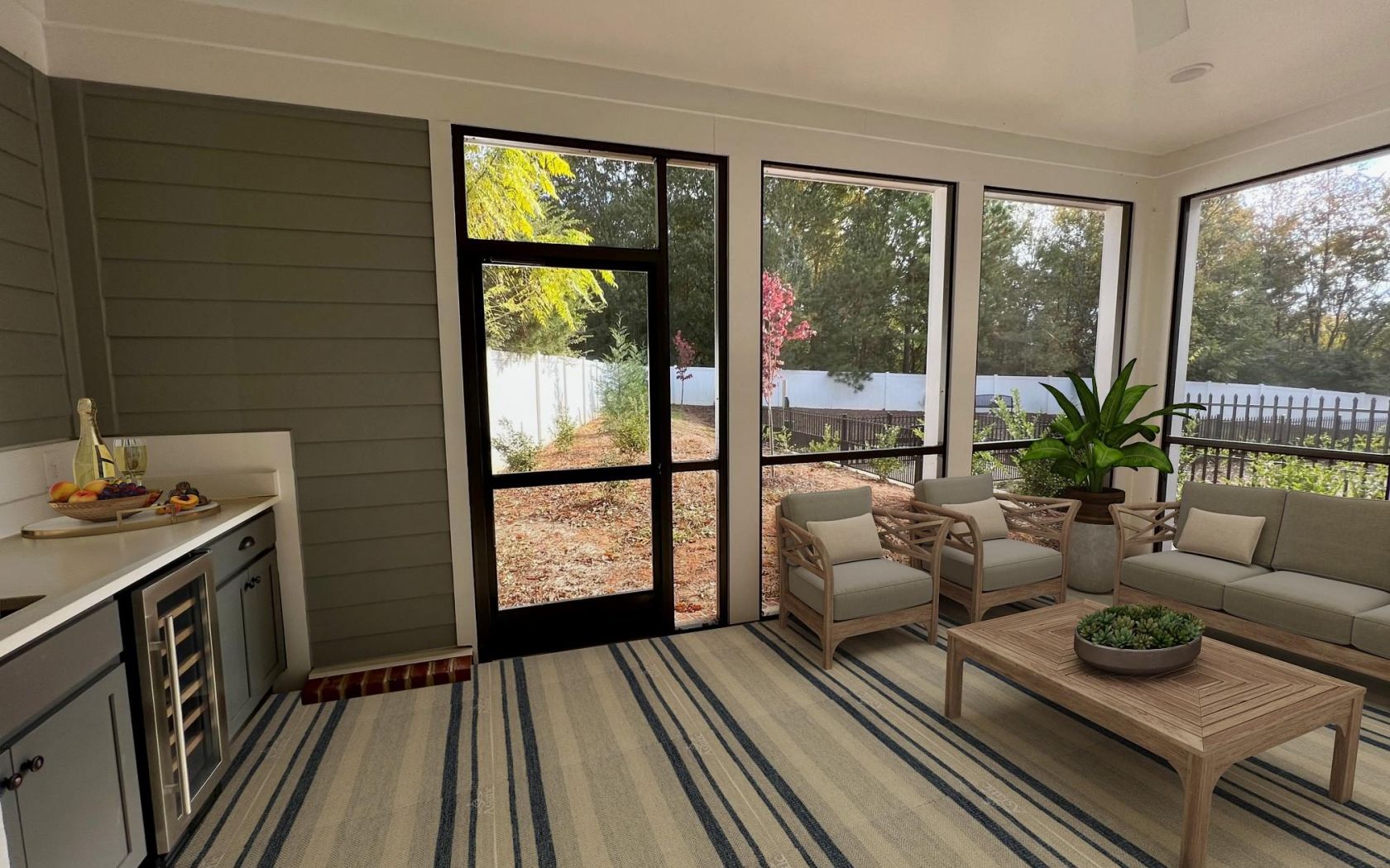 Townhomes at Bridlestone enclosed patio with couches. tables, and plants