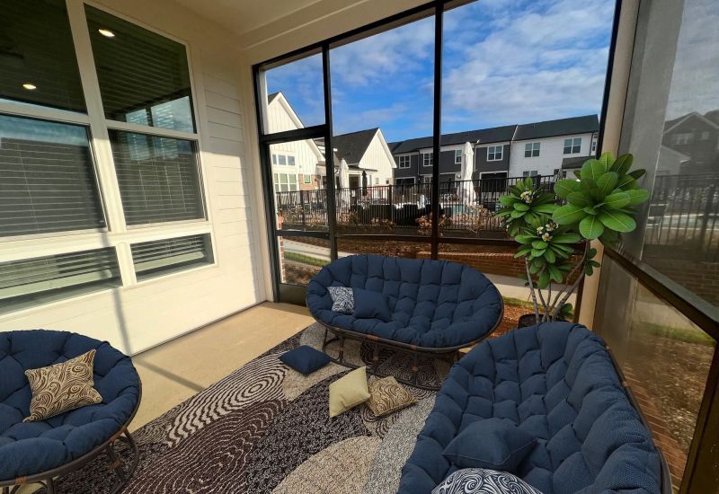 Townhomes at Bridlestone enclosed patio with couches and plants